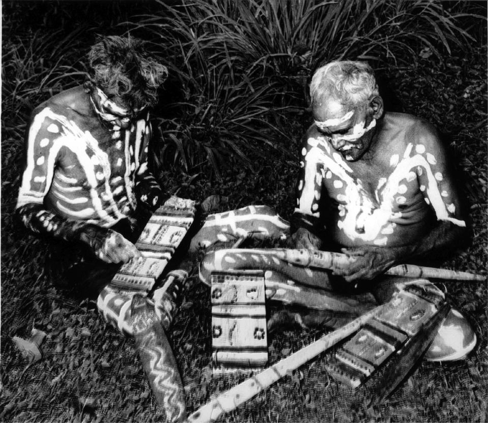 Decorated men painting objects at Cherbourg Aboriginal Settlement c1920
