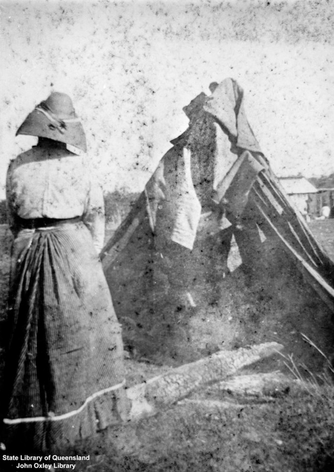 Woman and shelter at Barambah Aboriginal Settlement 1905