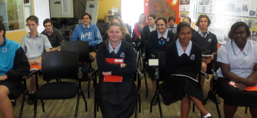 Students watching an archival film before their Q&A with the elders