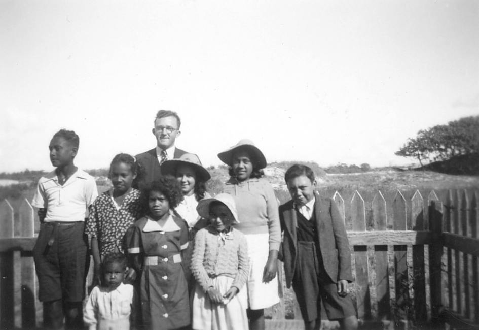 Children with man at AIM Church at Cherbourg c1950