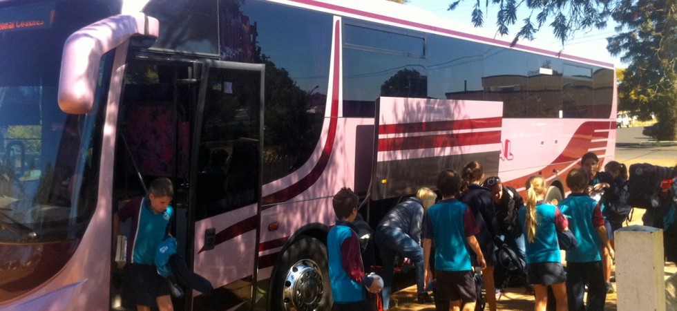 The school bus arrives with school students