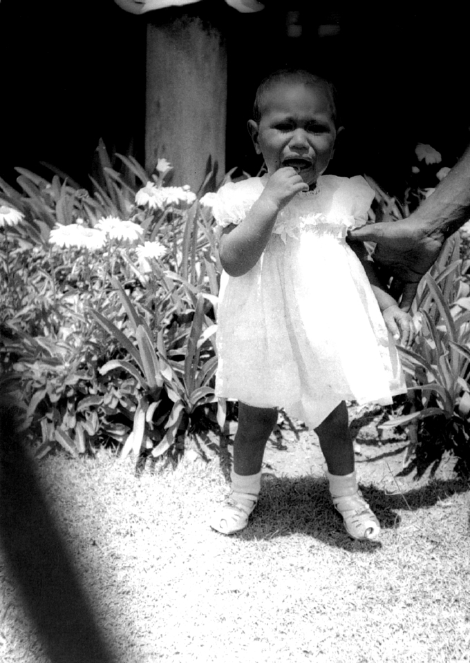Baby in garden at Cherbourg Hospital c1961