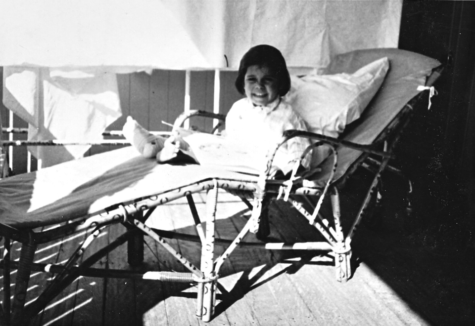 Girl on veranda at Cherbourg Hospital c1962