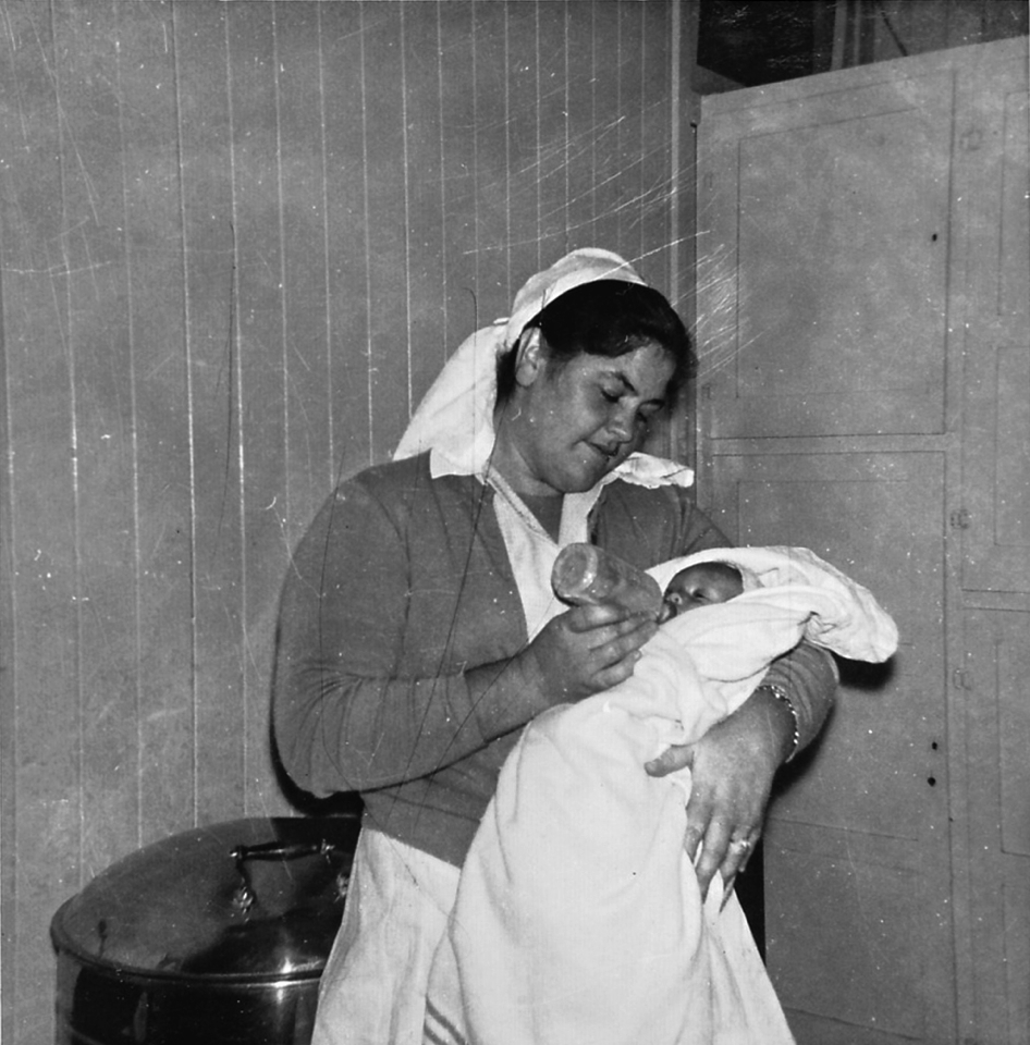 nurse-feeding-baby-at-cherbourg-hospital_1961