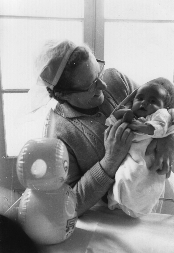 Nurse with baby at Cherbourg Hospital c1961