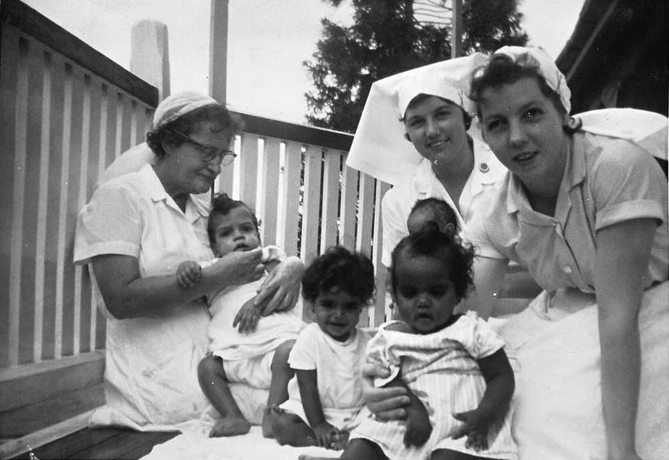 Nurses and babies on veranda at Cherbourg Hospital c1961