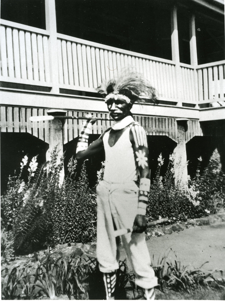 Man holding spear at Cherbourg Aboriginal Settlement c1930