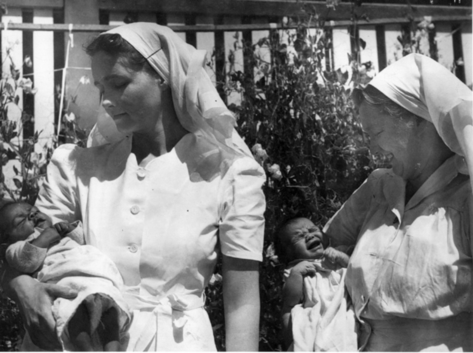 Nurse and Matron Rynne holding Richard Hooper Coleman at Cherbourg Hospital 1961