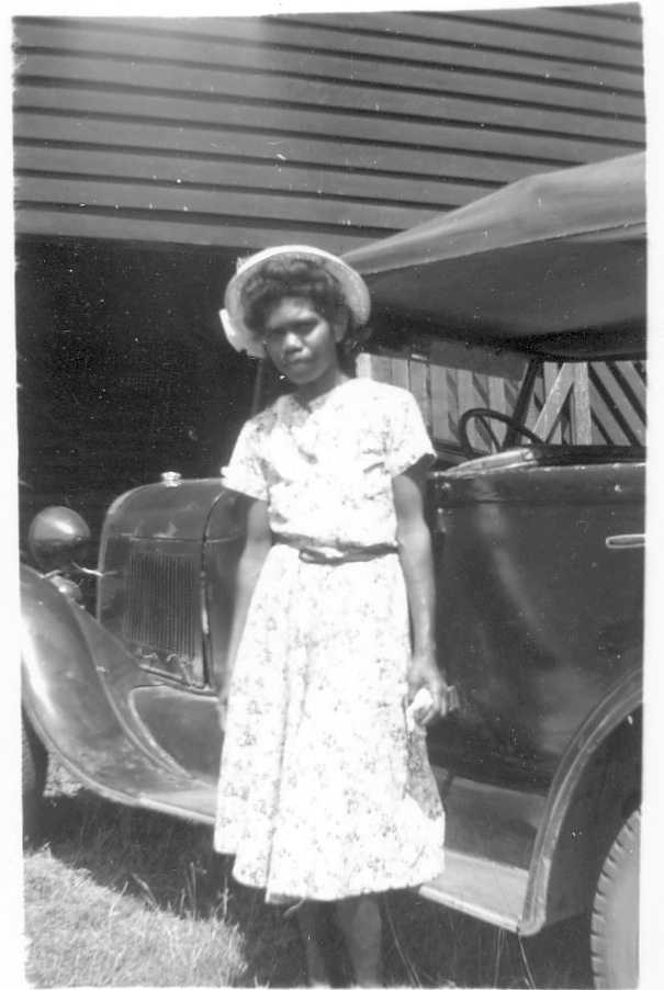 Woman-beside-car-at-Cherbourg-Aboriginal-Settlement_1940s