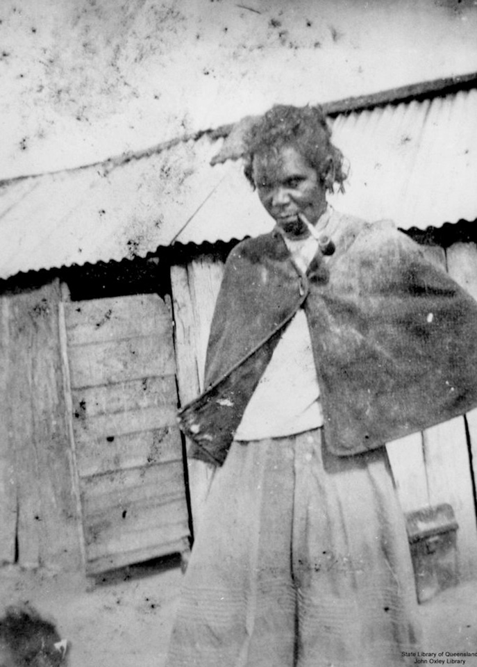 Woman with pipe at Barambah Aboriginal Settlement 1905